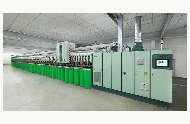 Official Rieter J 70 air jet spinning machine photographed in a textile mill